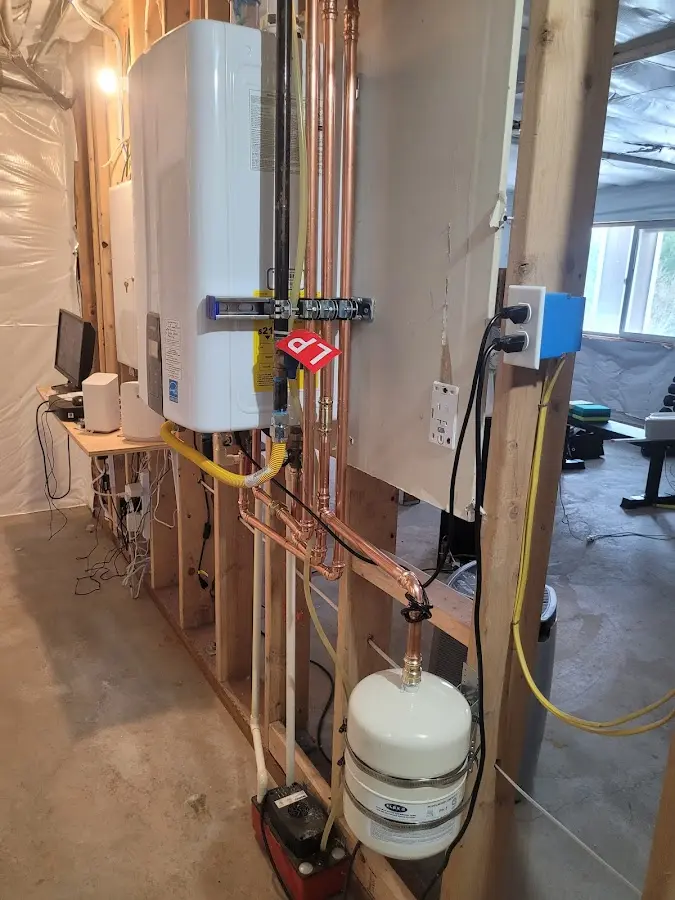 Licensed plumber repairing a kitchen sink in Strafford